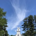 a cloud that appears as a dove over the church